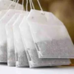 Biodegradable disposable tea bag filled with loose tea leaves - eco-friendly packaging