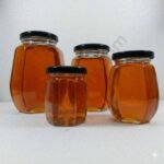 slanted hexagonal honey glass jar black lid